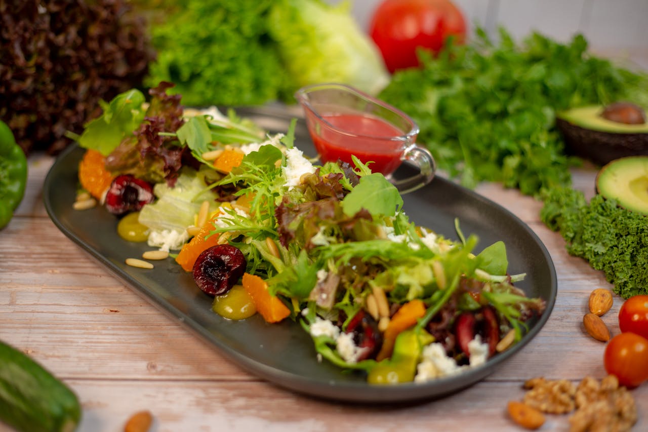 Mastering the First Impression: Your intriguing post title goes here A vibrant salad with mixed greens, nuts, and fruits, set on a stylish black plate, ideal for a healthy meal.